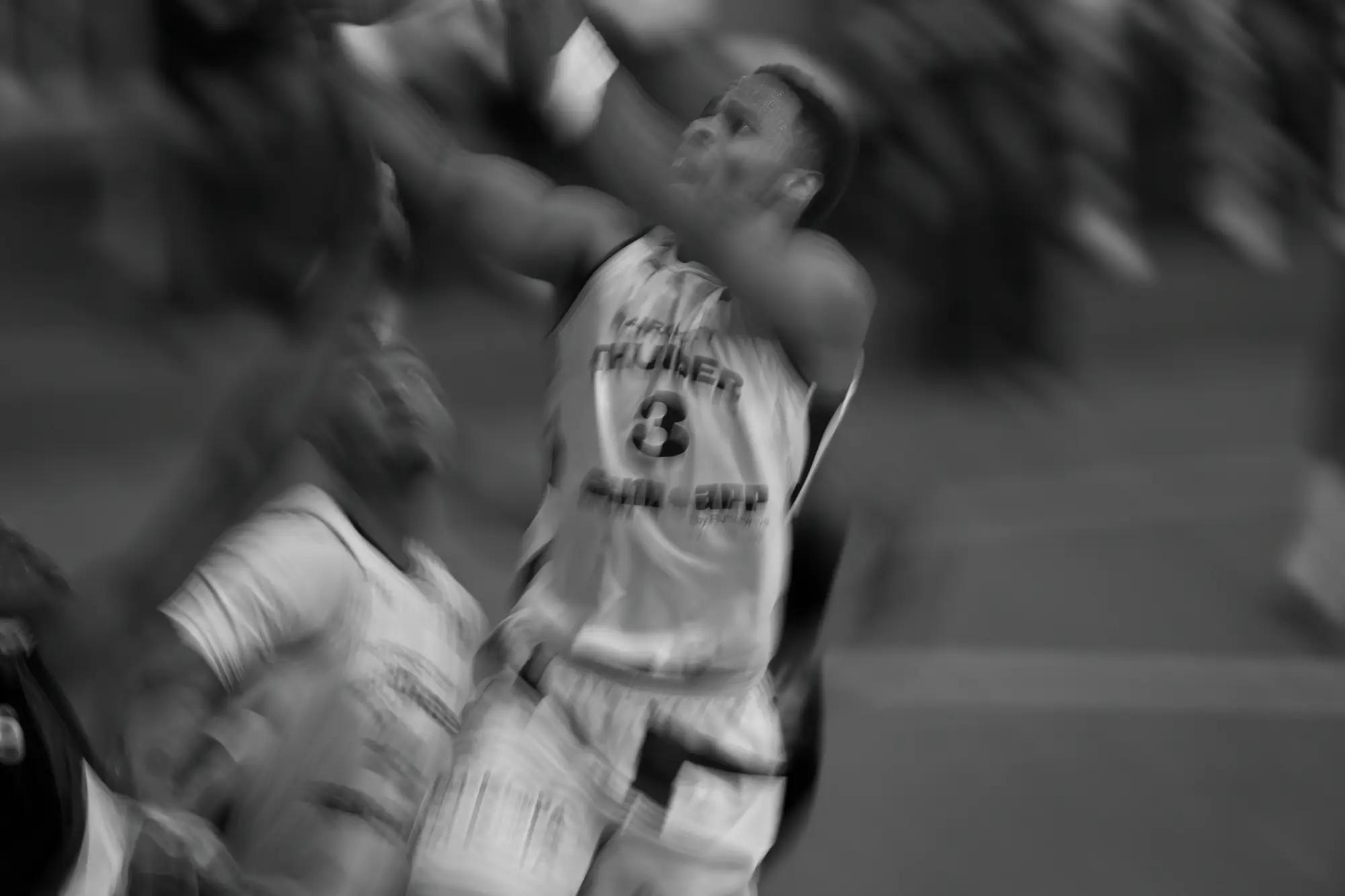 Thunder's number three rising to finish through contact, the whole frame streaked by a slow shutter
